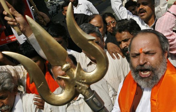 An activist of Rashtrawadi Sena holds a trishul as he shouts anti-Pakistan slogans during a protest in New Delhi